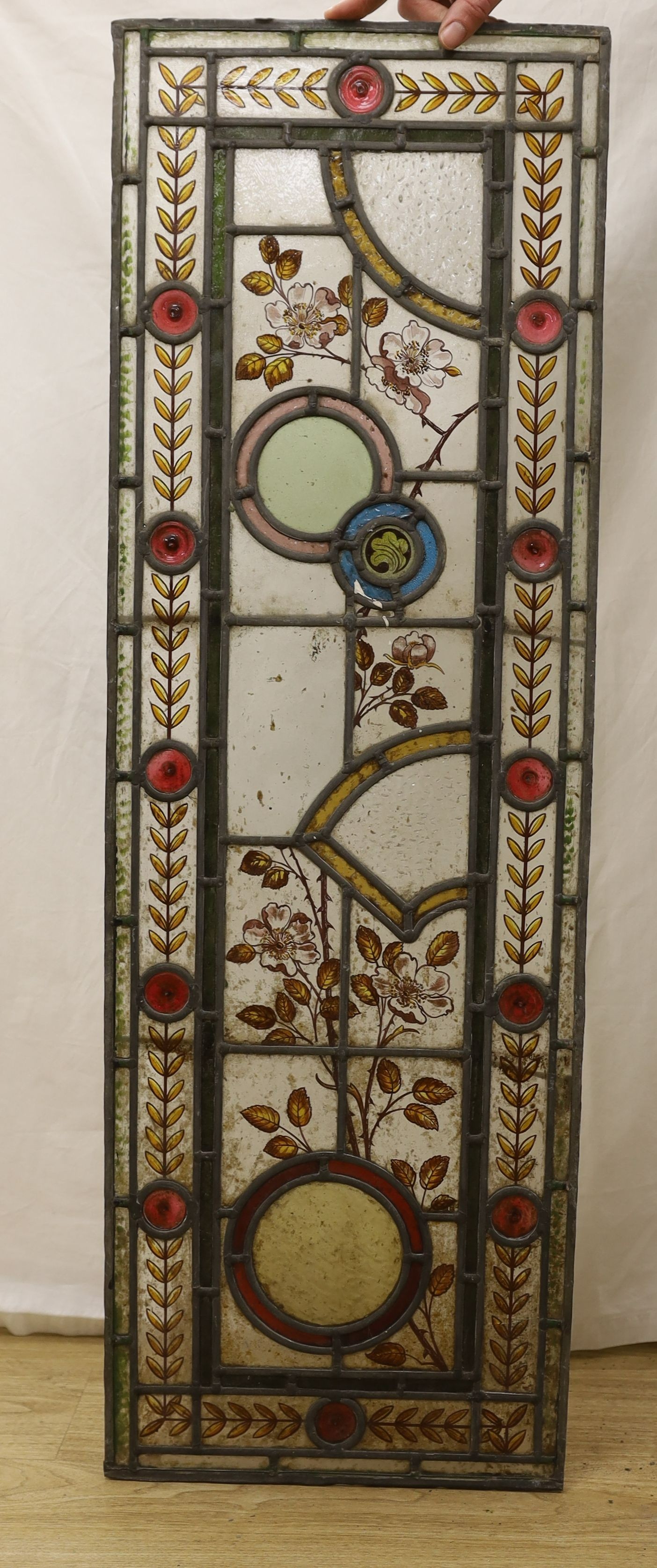 Two pairs of 19th century leaded and stained glass panels, 111cms high x 36.5 wide.